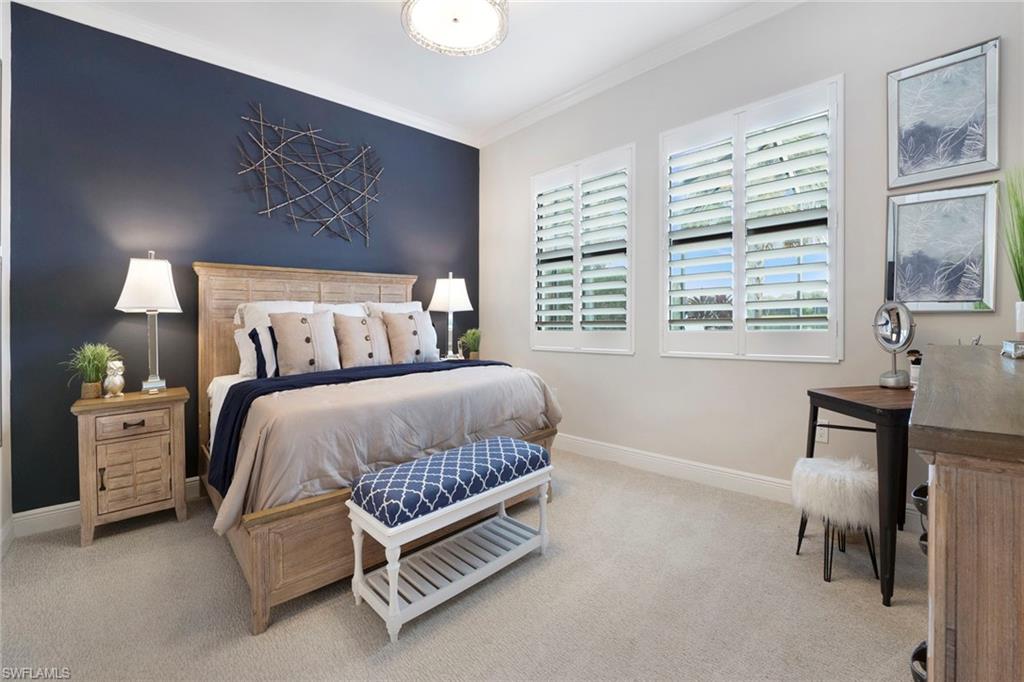 1410 Redona Way Naples, FL 34113 - Photo 20 of 50 a bedroom with a bed chair and a window