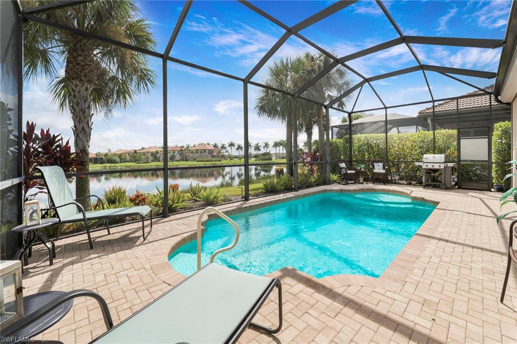 1410 Redona Way Naples, FL 34113 - Photo 2 of 50 a view of a swimming pool with a patio