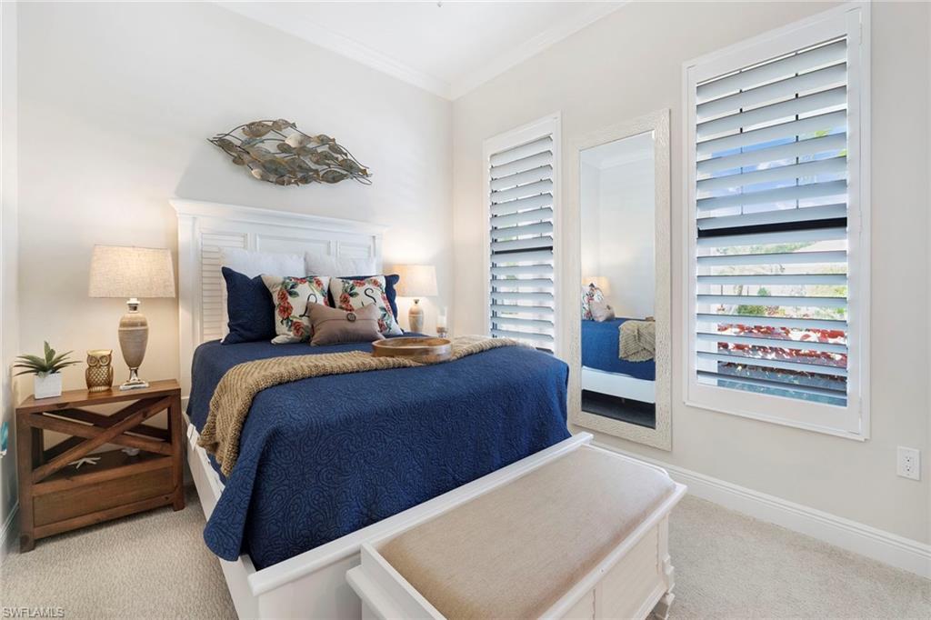 1410 Redona Way Naples, FL 34113 - Photo 26 of 50 a bedroom with a bed and a window