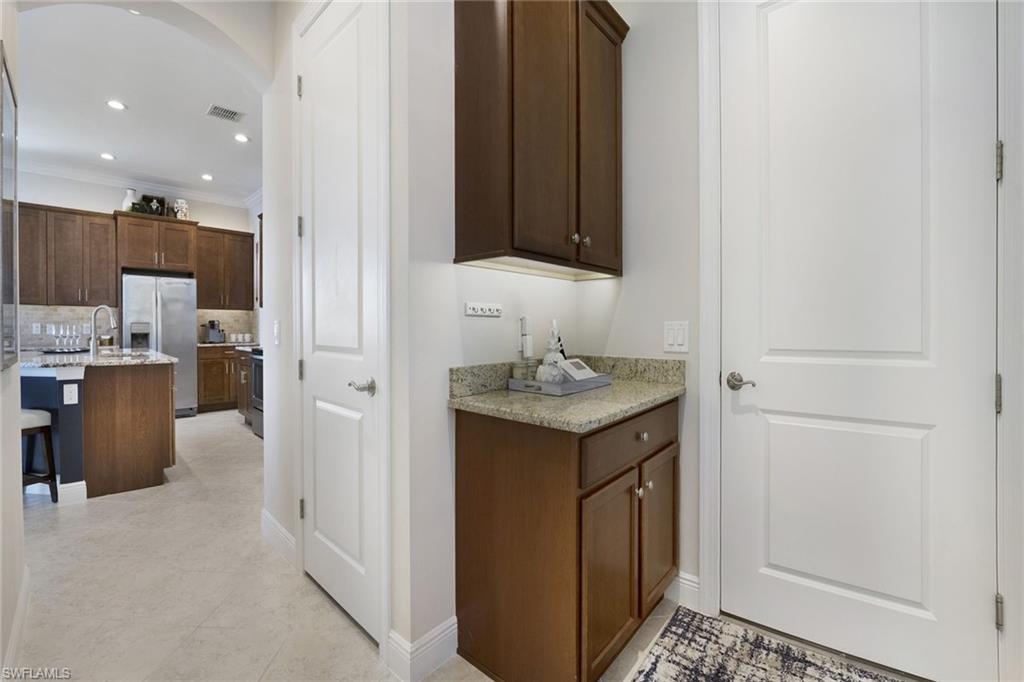 1410 Redona Way Naples, FL 34113 - Photo 29 of 50 a bathroom with a sink a vanity and a mirror