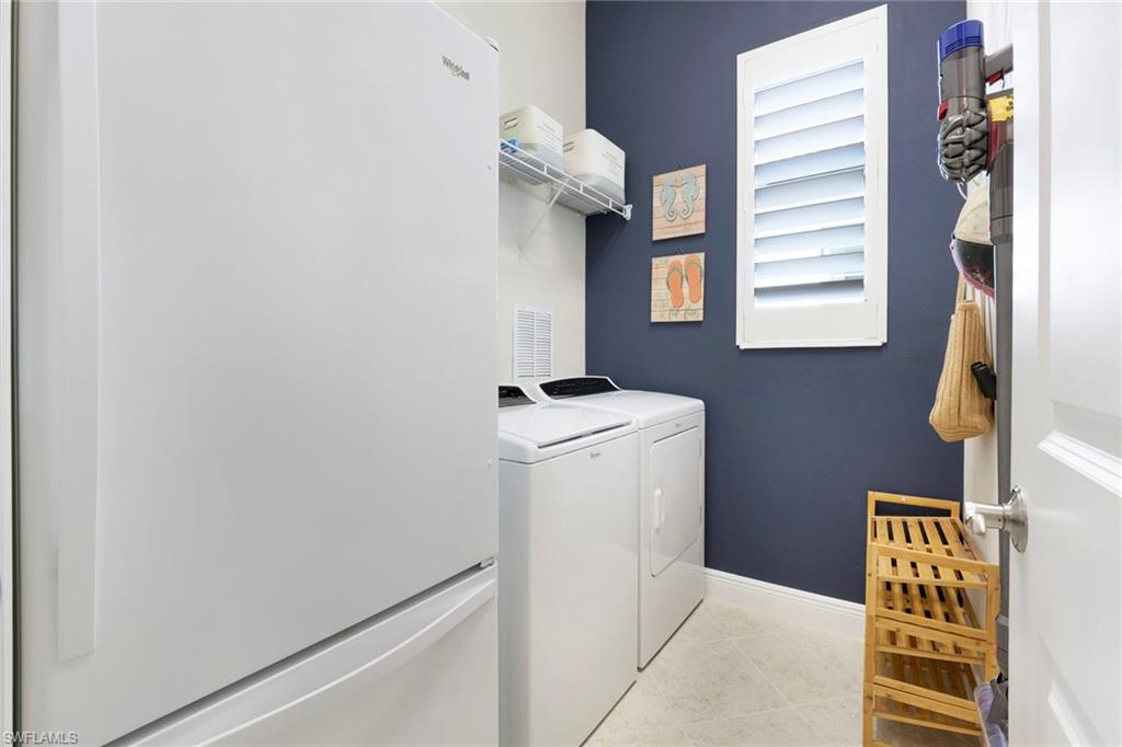 1410 Redona Way Naples, FL 34113 - Photo 30 of 50 a utility room with dryer and washer