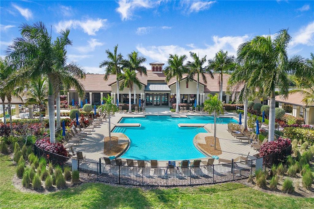 1410 Redona Way Naples, FL 34113 - Photo 36 of 50 a swimming pool with outdoor seating water slide and outdoor seating