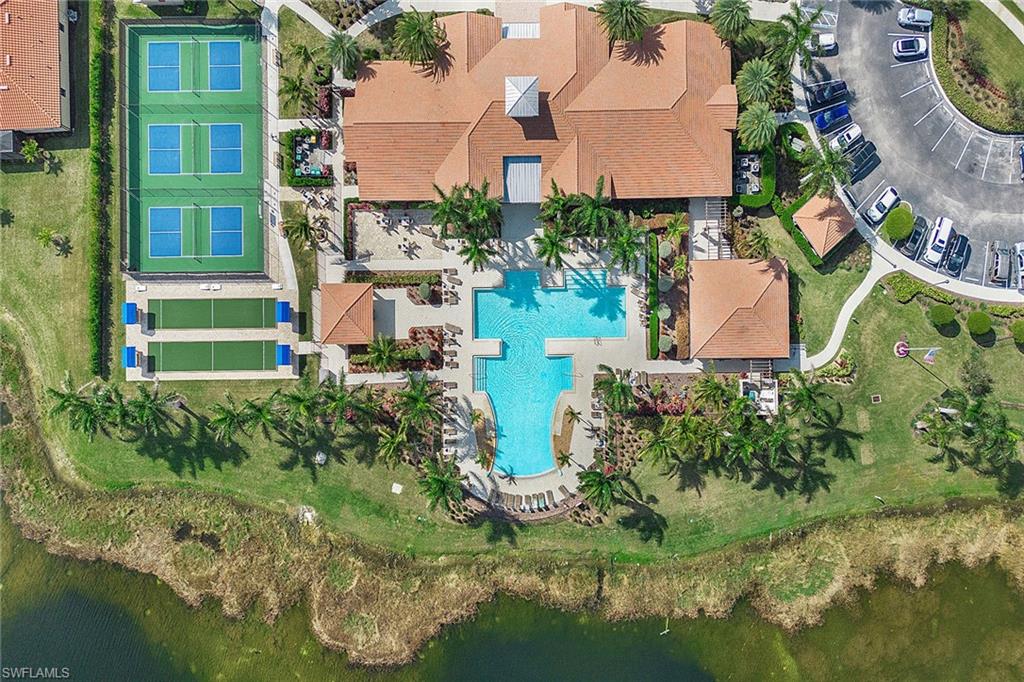 1410 Redona Way Naples, FL 34113 - Photo 38 of 50 an aerial view of a house with a garden and lake view