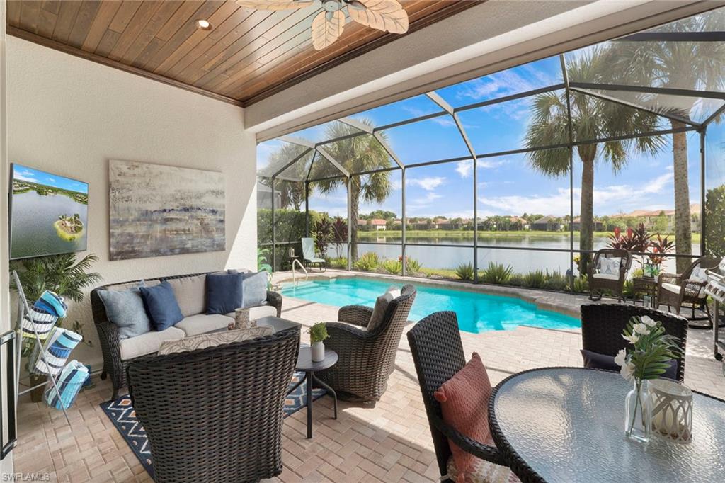 1410 Redona Way Naples, FL 34113 - Photo 4 of 50 swimming outdoor view with a sitting space