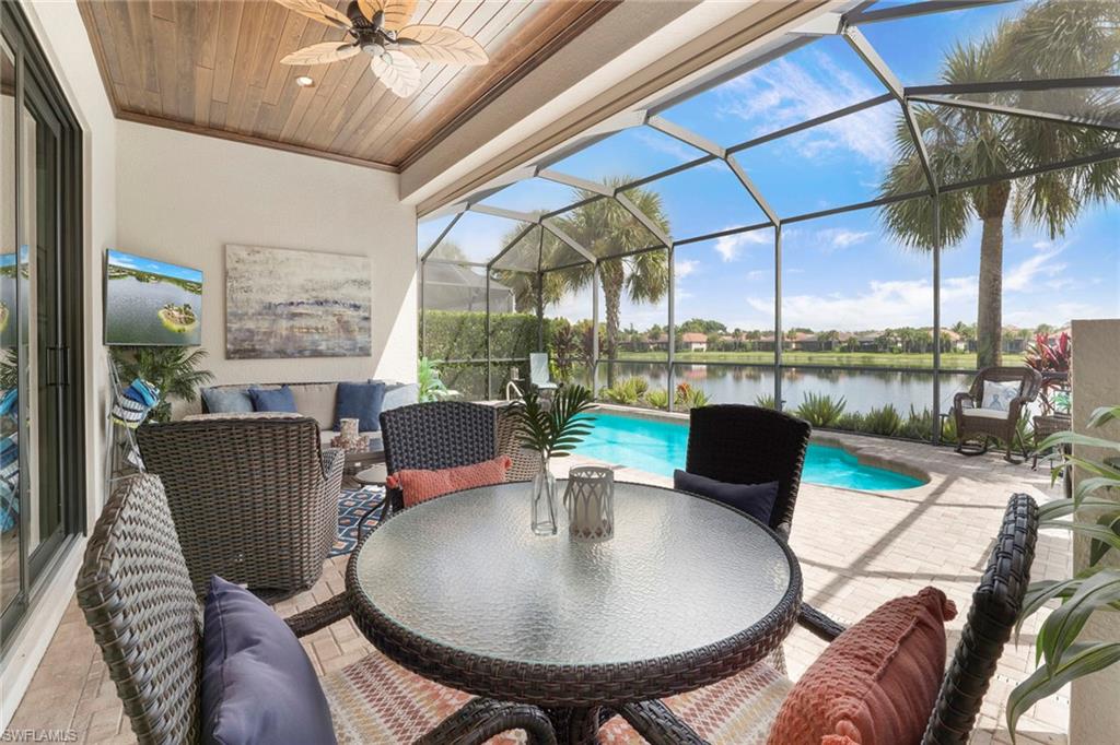 1410 Redona Way Naples, FL 34113 - Photo 5 of 50 a living room with furniture and a floor to ceiling window