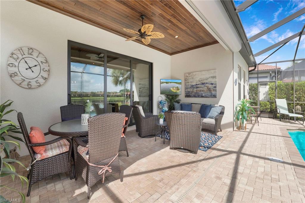 1410 Redona Way Naples, FL 34113 - Photo 6 of 50 a dining room with furniture and wooden floor