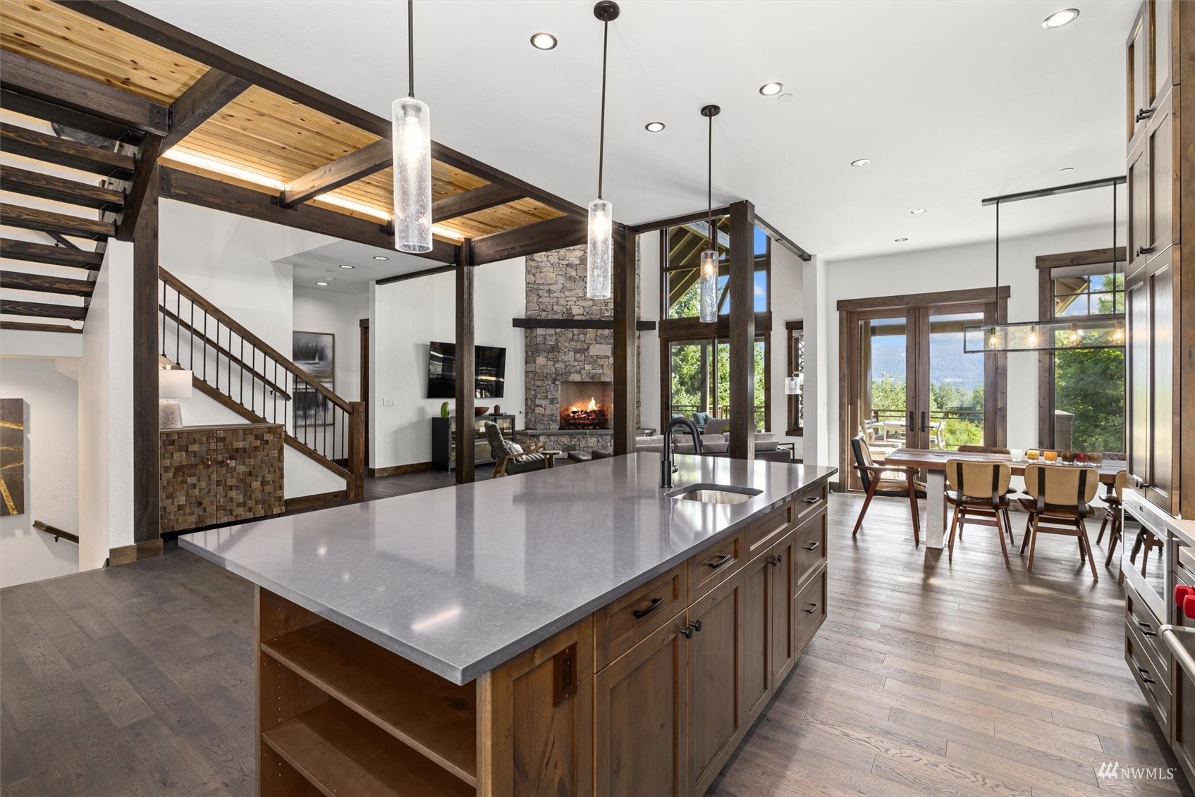 110 Queens Loop Cle Elum, WA 98922 - Photo 11 of 39 a open kitchen with stainless steel appliances granite countertop a kitchen island a stove a dining table and chairs