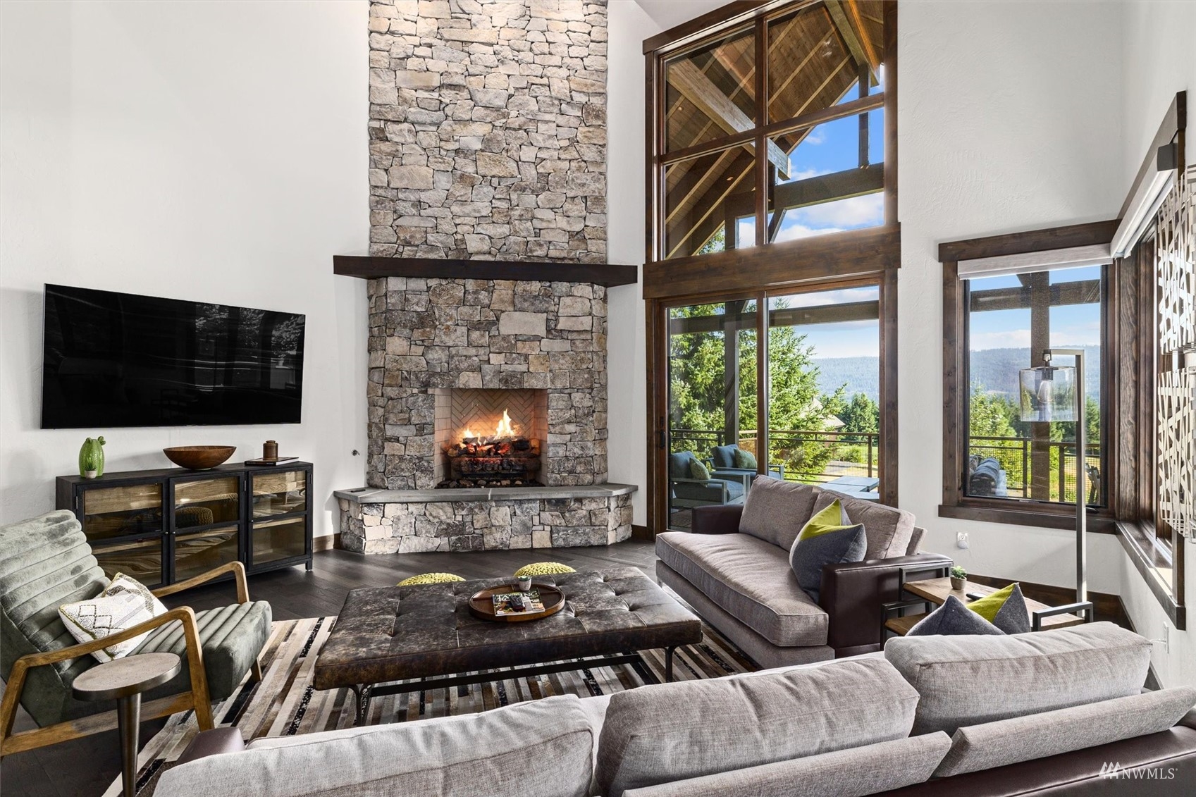110 Queens Loop Cle Elum, WA 98922 - Photo 3 of 39 a living room with furniture a flat screen tv and a fireplace