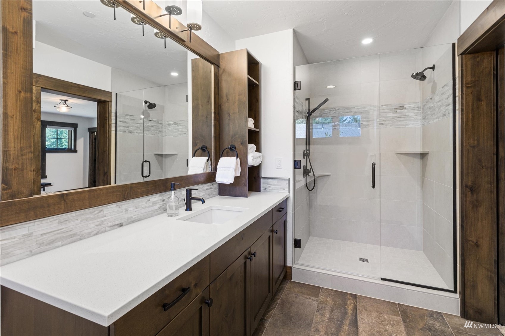 110 Queens Loop Cle Elum, WA 98922 - Photo 33 of 39 a bathroom with a shower sink and mirror