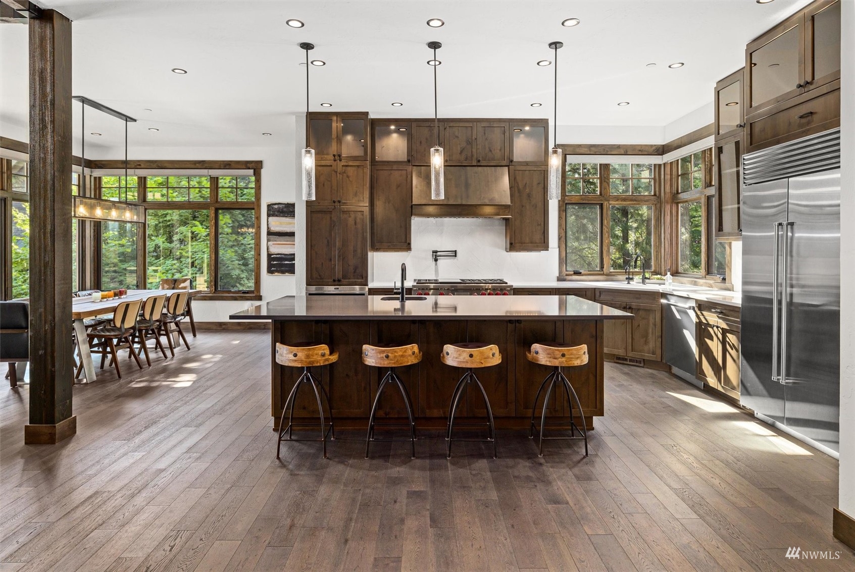 110 Queens Loop Cle Elum, WA 98922 - Photo 8 of 39 a dining hall with stainless steel appliances granite countertop a stove a kitchen island a table and chairs