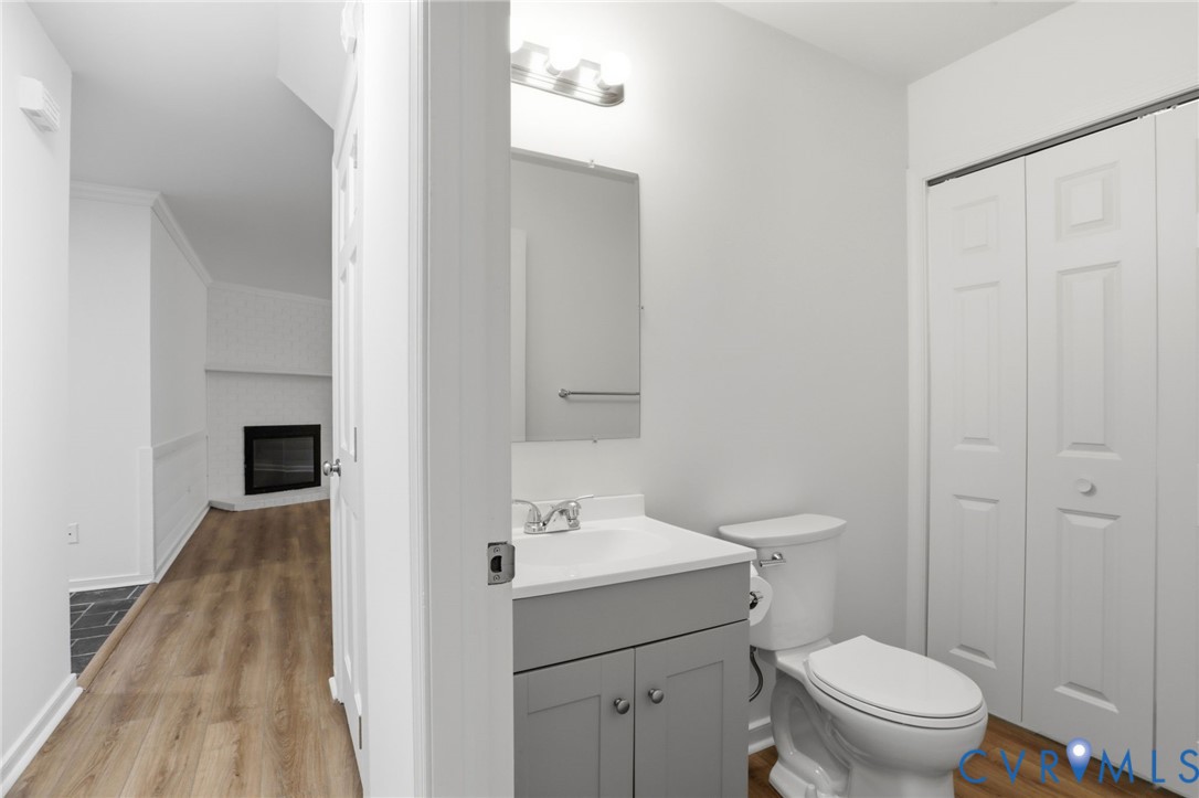 13913 Barnes Spring Road Midlothian, VA 23112 - Photo 16 of 51 Bathroom with a gray vanity, mirror, and a toilet