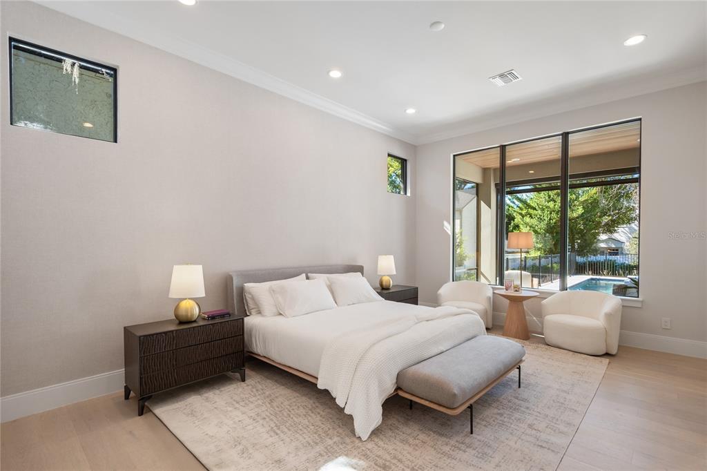 1751 Glencoe Road Winter Park, FL 32789 - Photo 16 of 45 a bedroom with a bed and glass window
