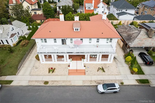 an aerial view of a house with parking space