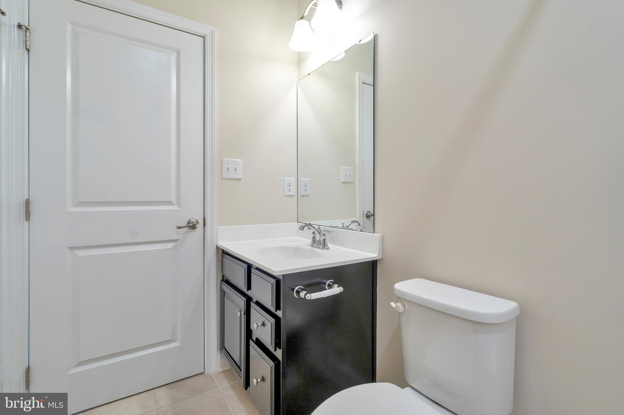 102 Patriots Path Malvern, PA 19355 - Photo 14 of 30 a bathroom with a sink a toilet and shower