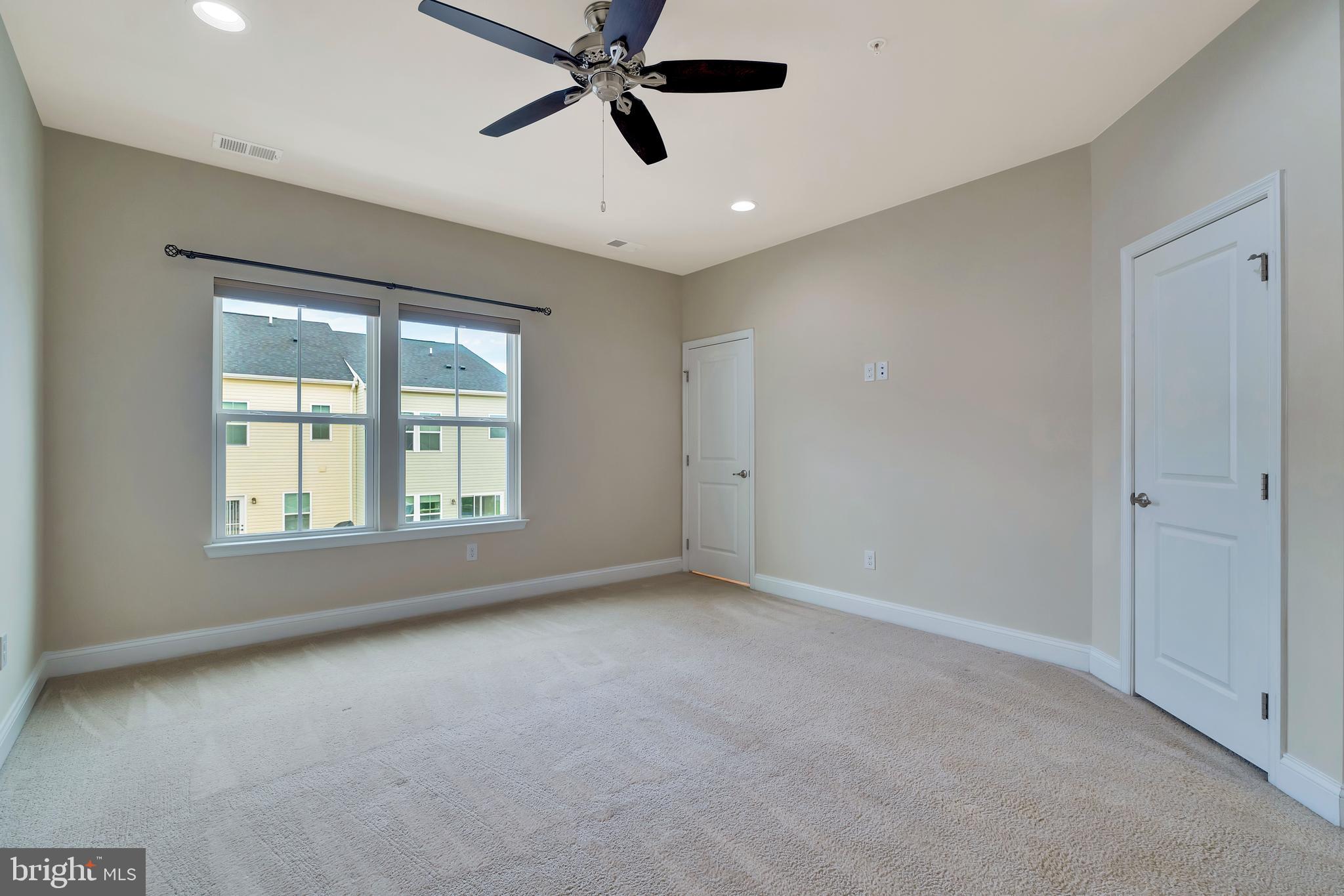 102 Patriots Path Malvern, PA 19355 - Photo 17 of 30 a view of an empty room with a window
