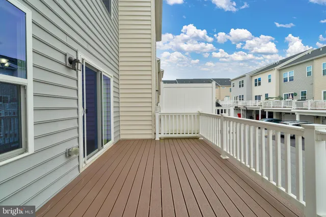 a view of a balcony with wooden floor
