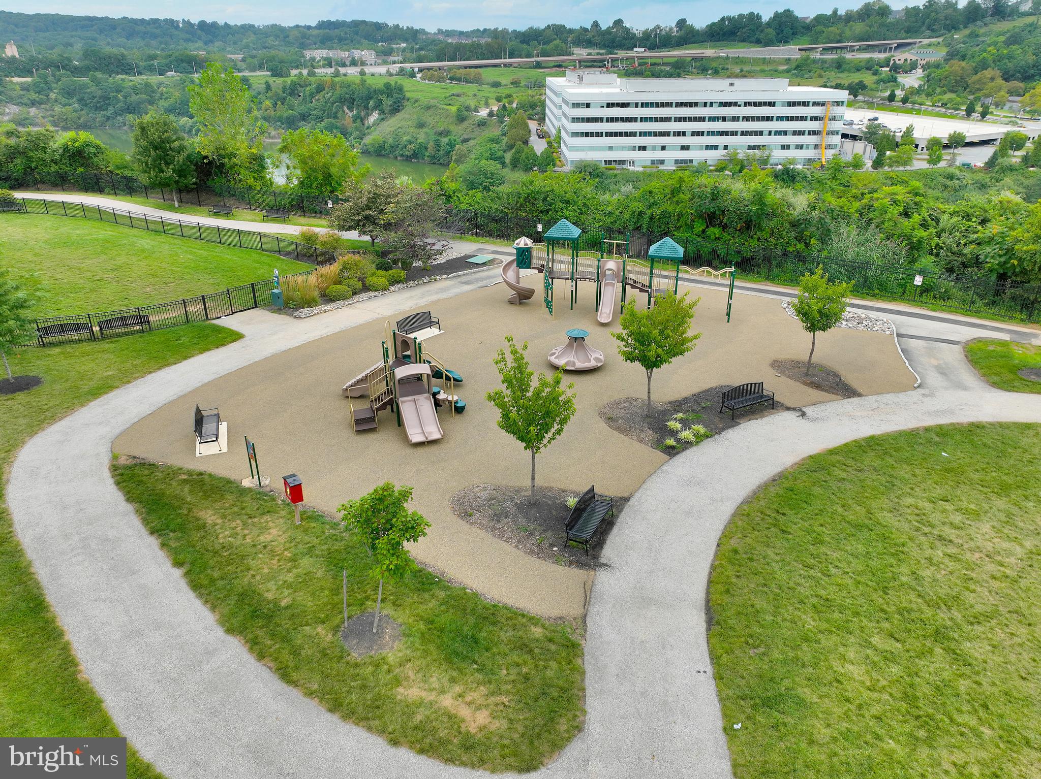 102 Patriots Path Malvern, PA 19355 - Photo 24 of 30 a view of a swimming pool with a patio and a garden