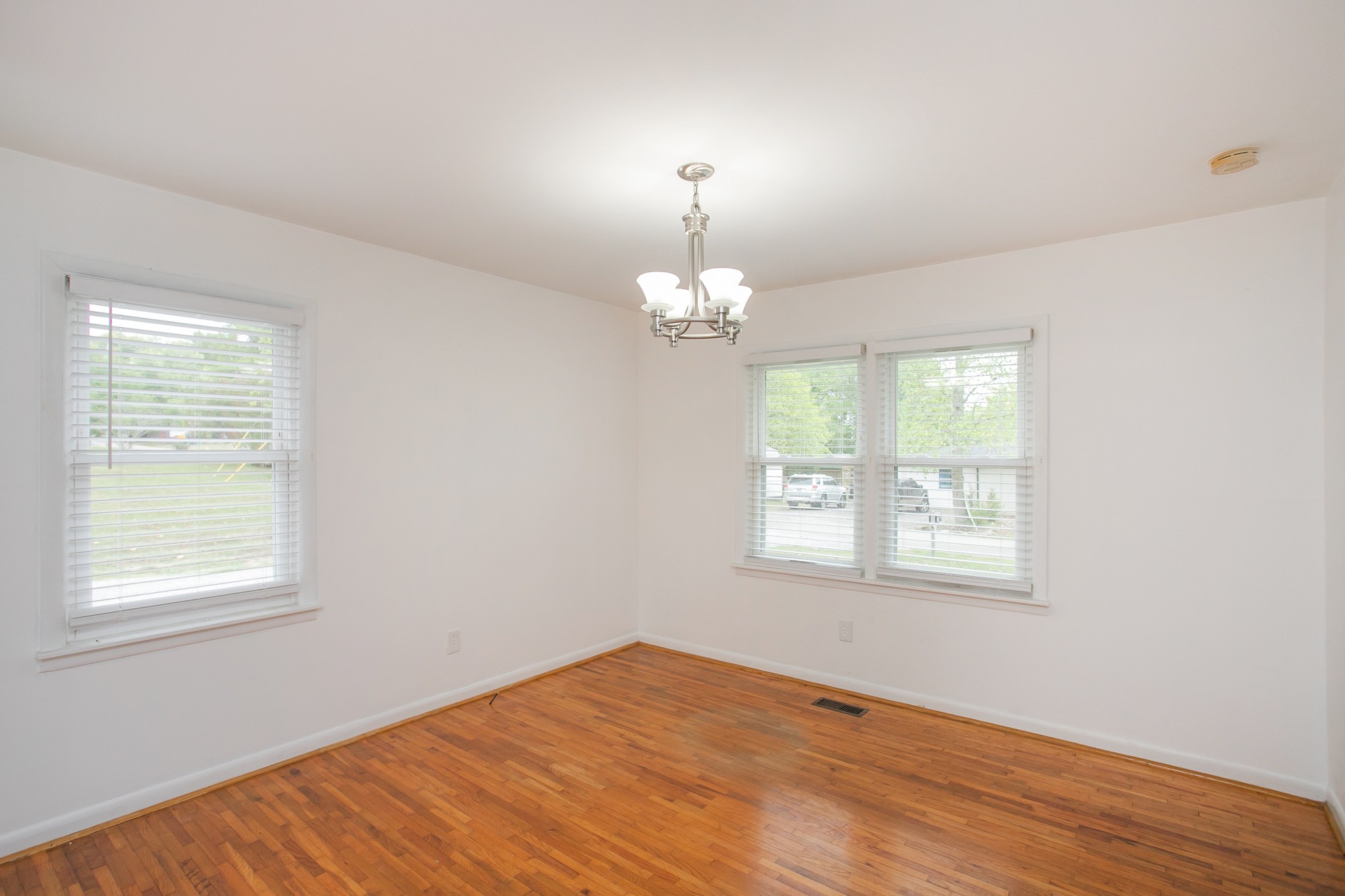 129 Poplar Street Eagleville, TN 37060 - Photo 11 of 23 a view of an empty room with wooden floor and a window