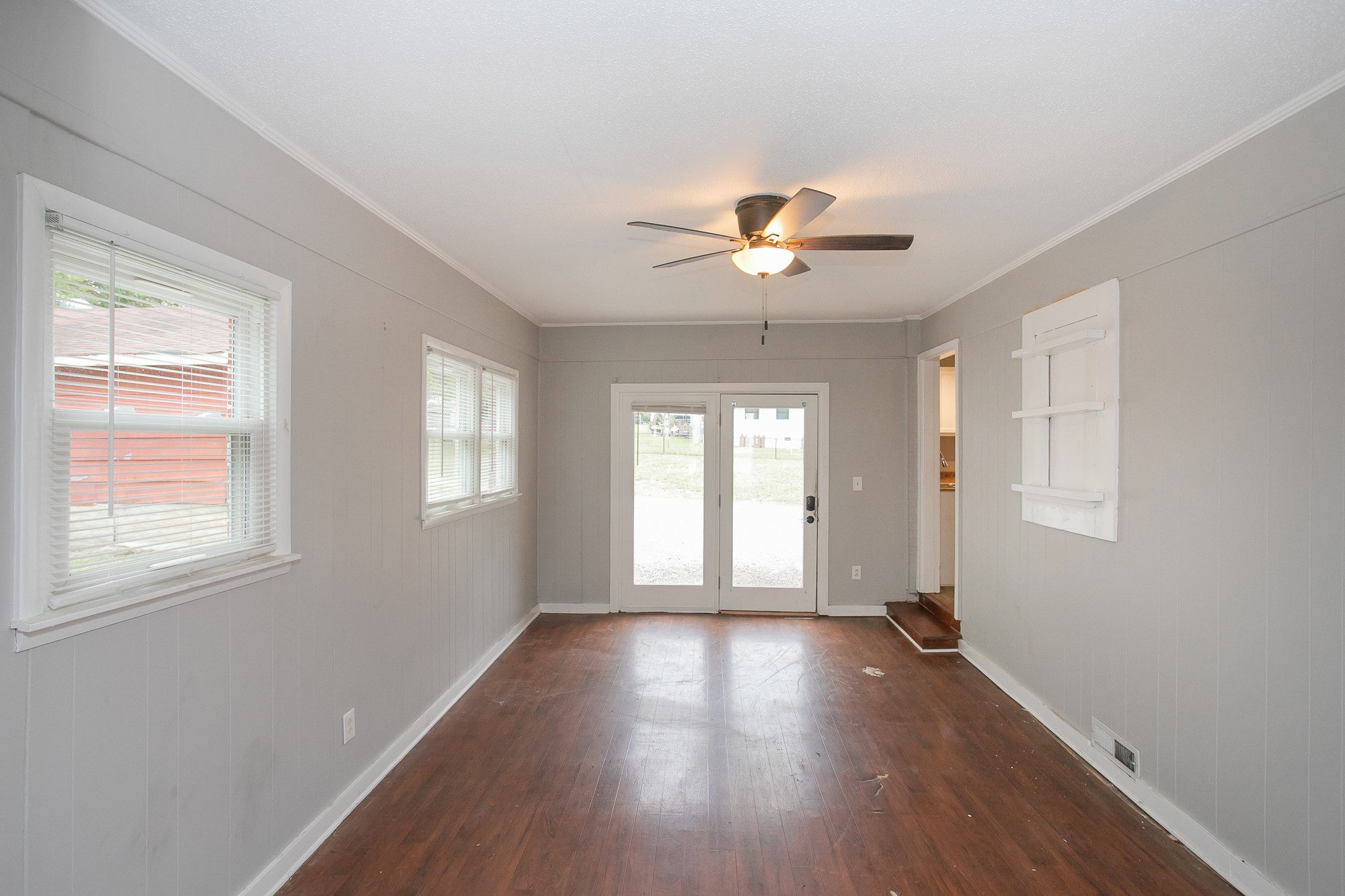 129 Poplar Street Eagleville, TN 37060 - Photo 12 of 23 a view of an empty room with a window and wooden floor