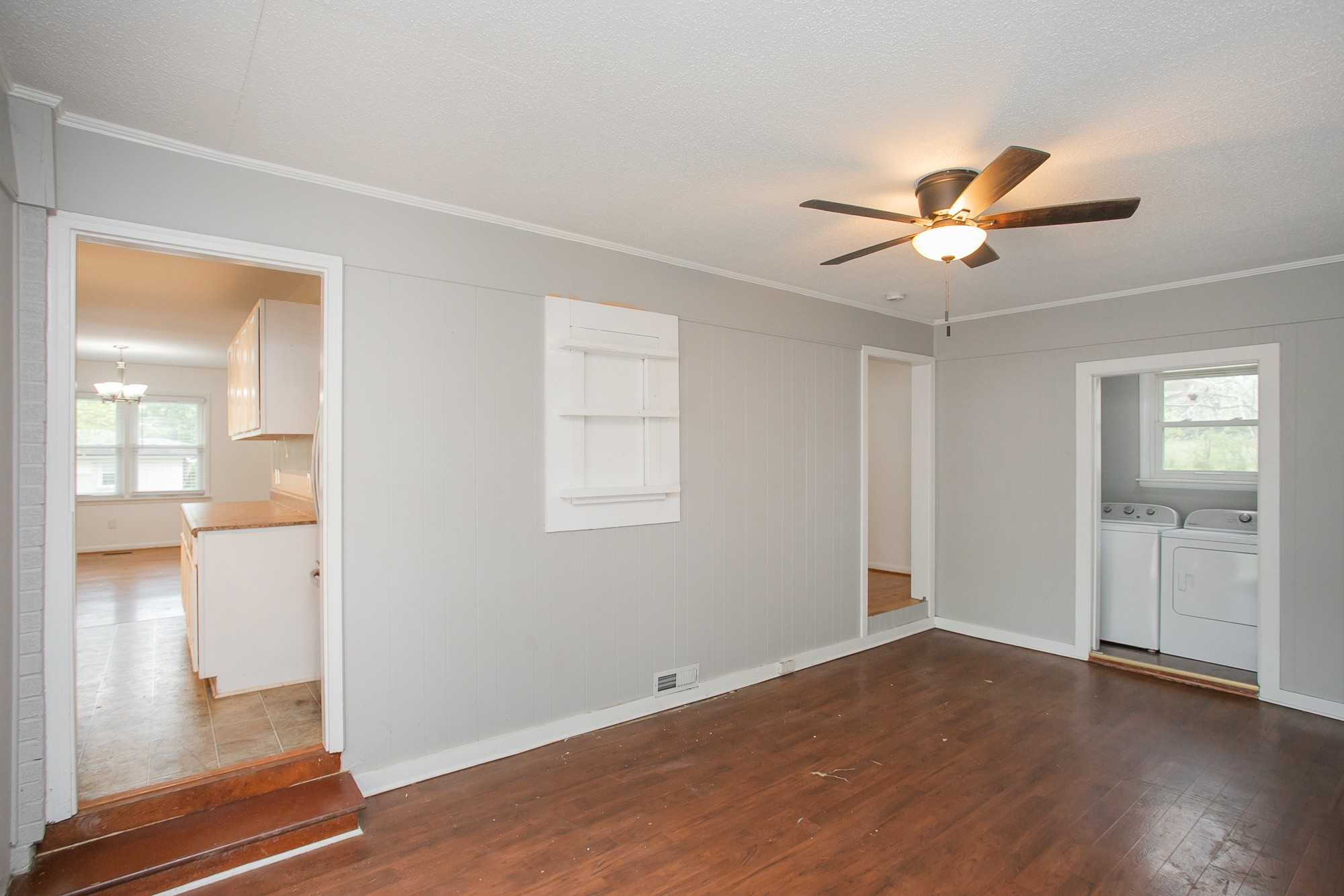 129 Poplar Street Eagleville, TN 37060 - Photo 13 of 23 a view of a livingroom with wooden floor and a ceiling fan