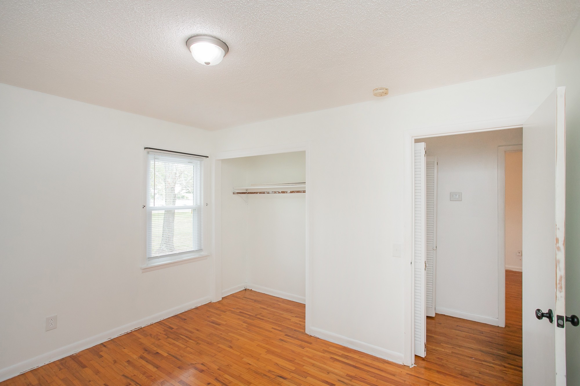 129 Poplar Street Eagleville, TN 37060 - Photo 16 of 23 a view of empty room with wooden floor and fan