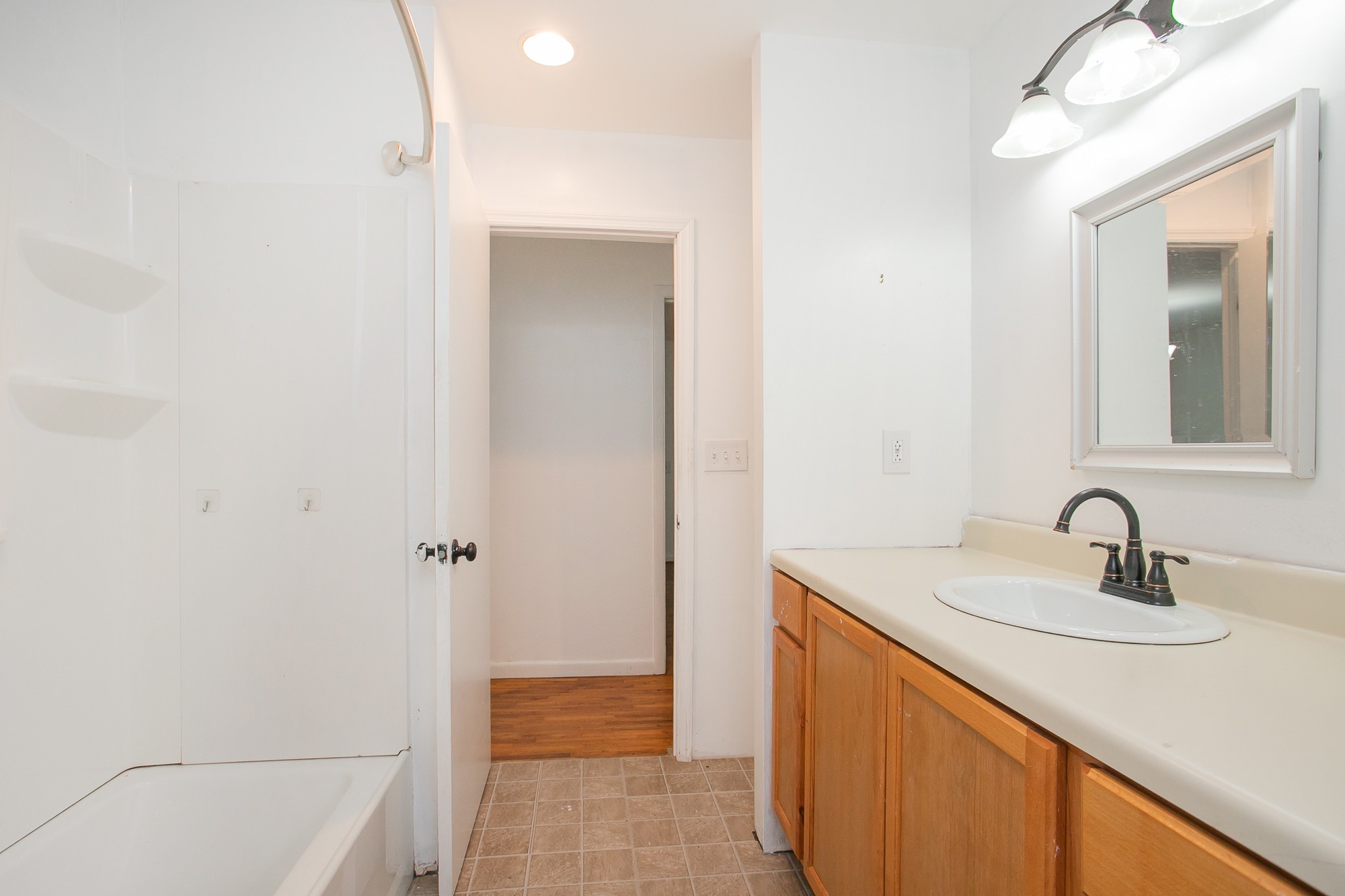 129 Poplar Street Eagleville, TN 37060 - Photo 21 of 23 a bathroom with a sink and a mirror