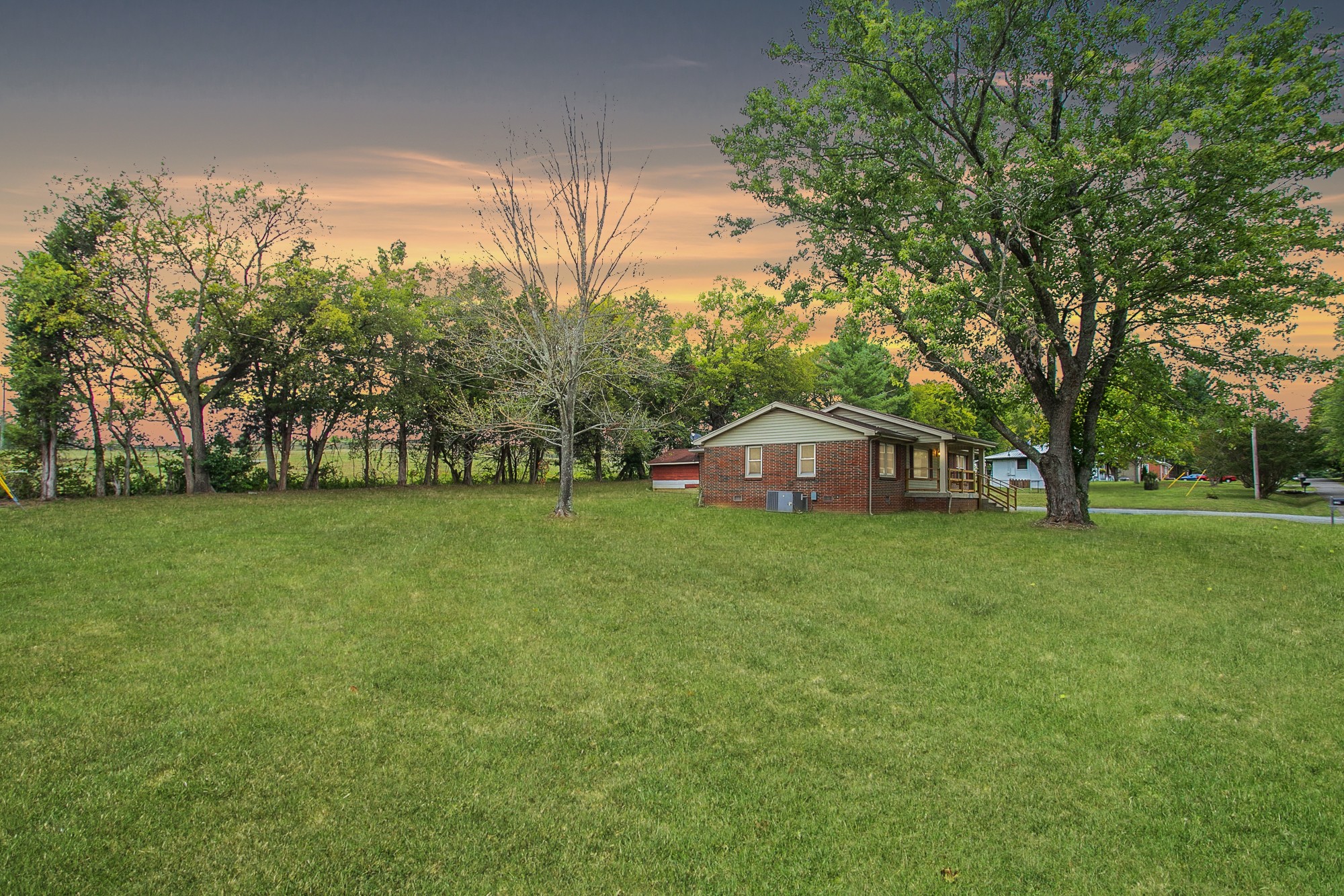 129 Poplar Street Eagleville, TN 37060 - Photo 3 of 23 a front view of a house with garden