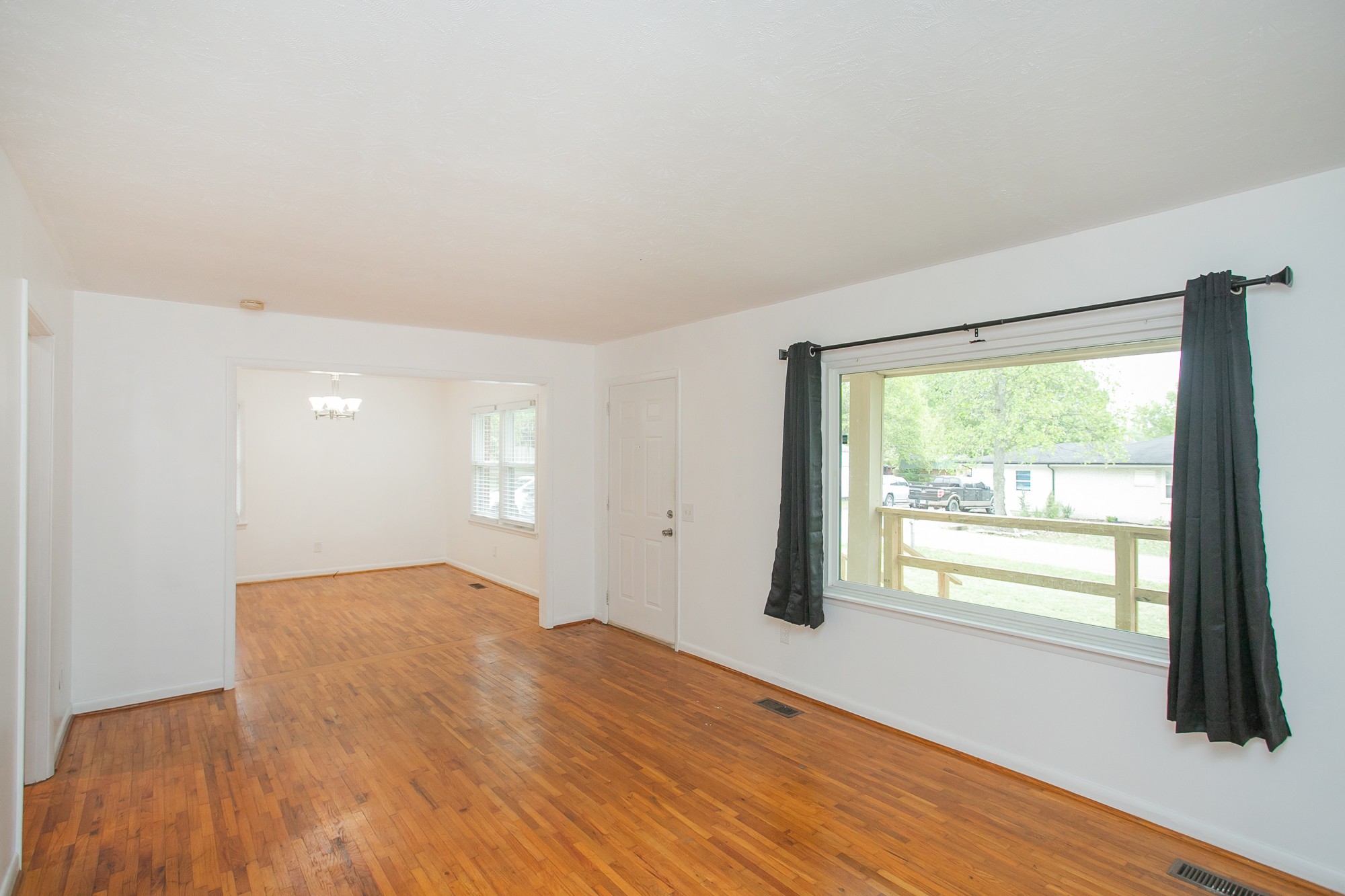 129 Poplar Street Eagleville, TN 37060 - Photo 6 of 23 a view of empty room with wooden floor and fan