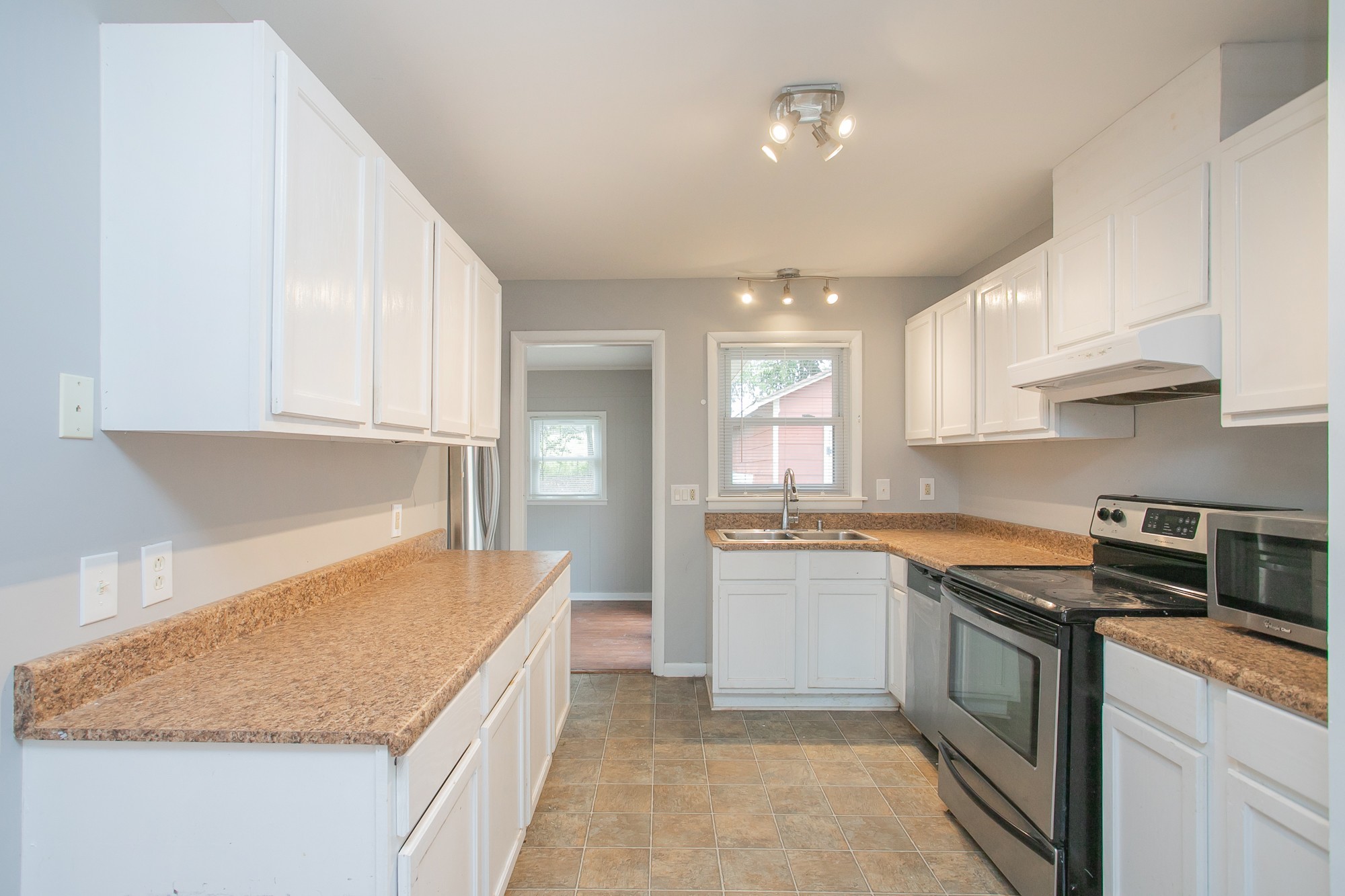 129 Poplar Street Eagleville, TN 37060 - Photo 7 of 23 a kitchen with a sink stove and cabinets