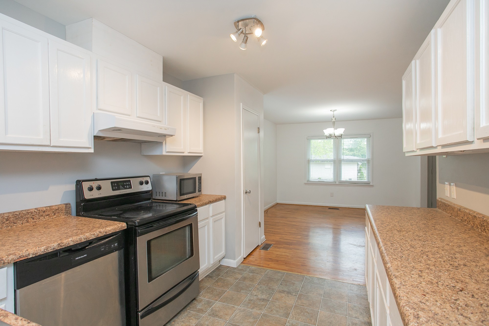 129 Poplar Street Eagleville, TN 37060 - Photo 8 of 23 a kitchen that has a sink and a stove