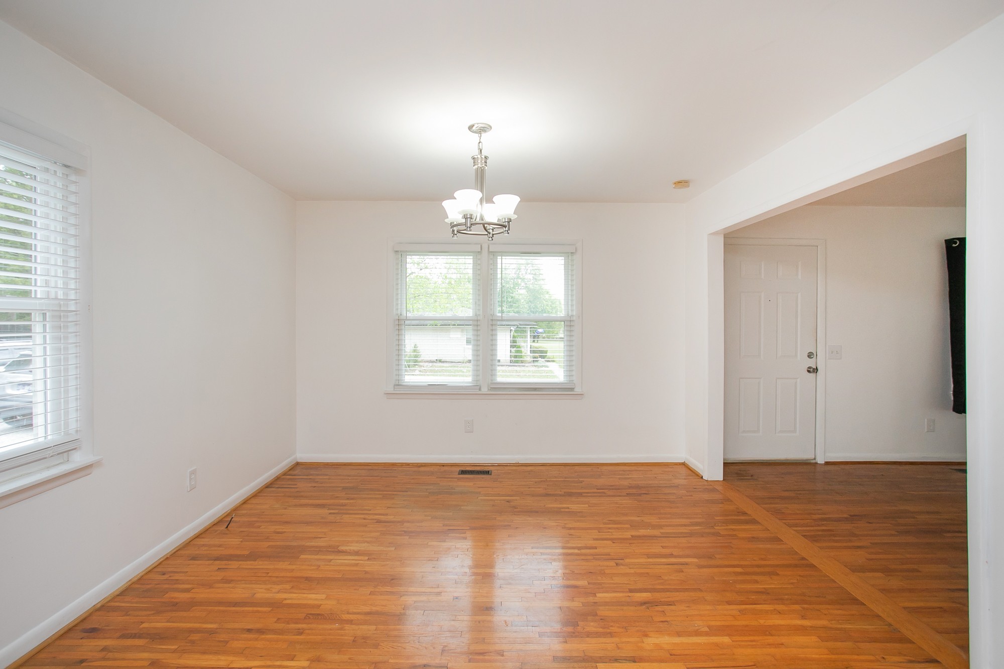 129 Poplar Street Eagleville, TN 37060 - Photo 9 of 23 a view of empty room with wooden floor and fan