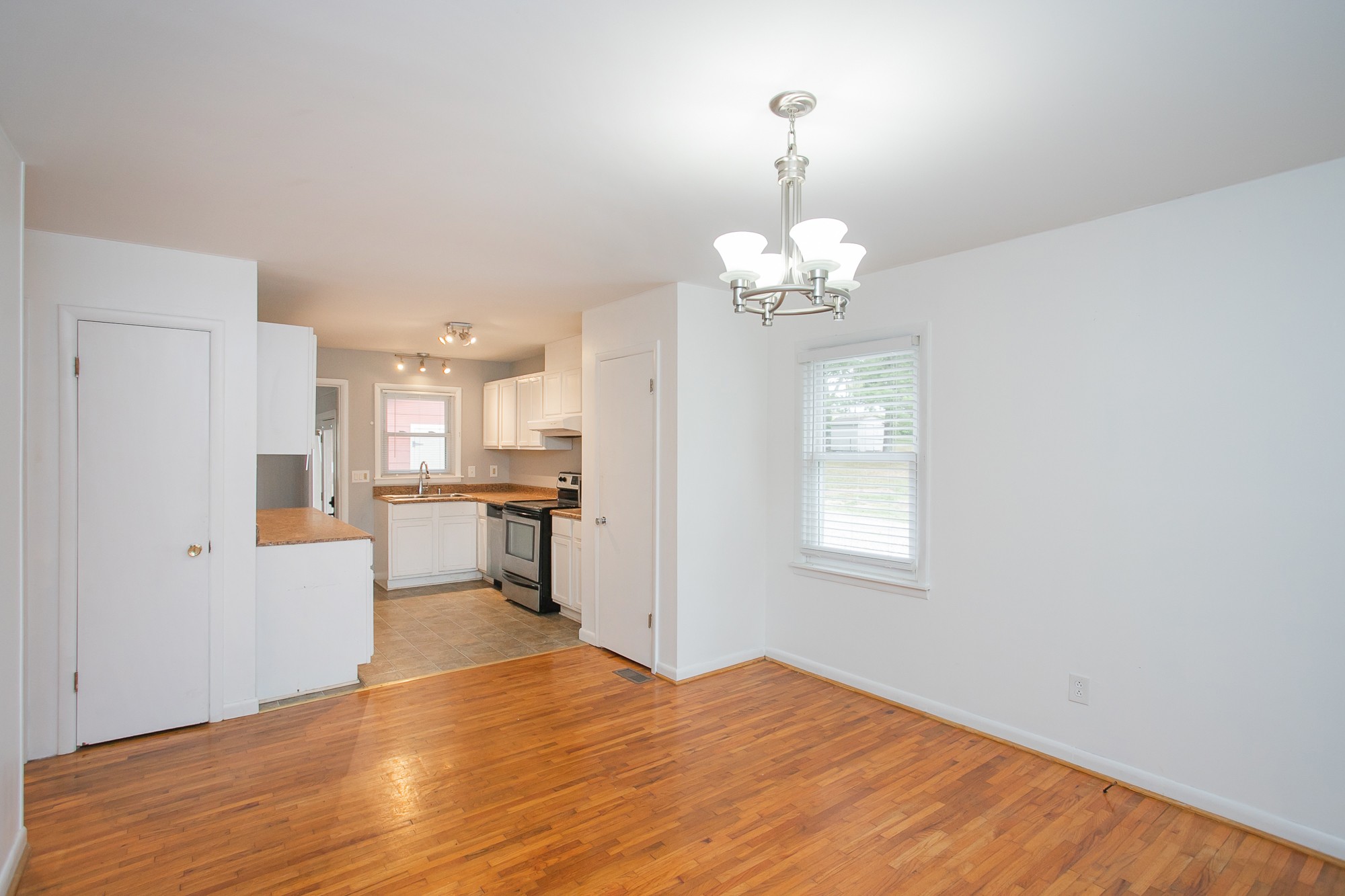 129 Poplar Street Eagleville, TN 37060 - Photo 10 of 23 a view of a room with wooden floor kitchen view and a window