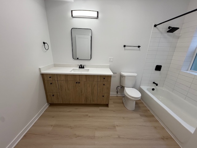 7717 North Sheridan Road, Unit 3R Chicago, IL 60626 - Photo 14 of 17 a bathroom with a granite countertop toilet a sink and bathtub