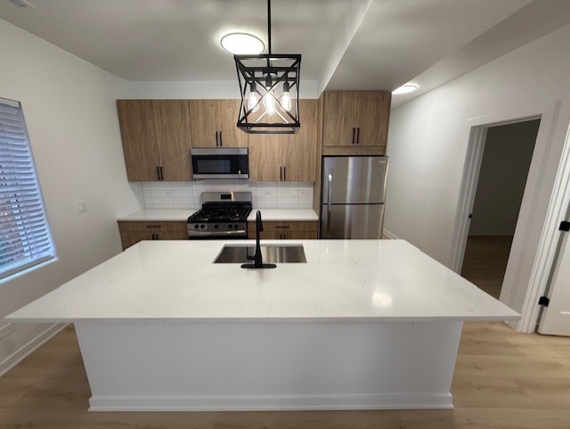 7717 North Sheridan Road, Unit 3R Chicago, IL 60626 - Photo 2 of 17 a kitchen with stainless steel appliances a refrigerator and a stove top oven
