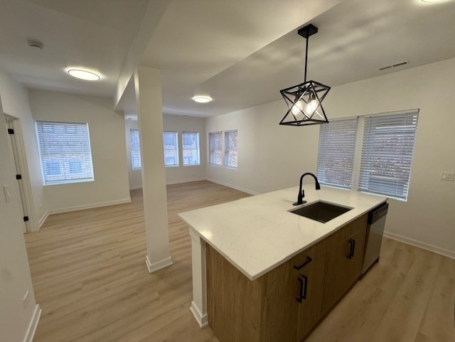 7717 North Sheridan Road, Unit 3R Chicago, IL 60626 - Photo 4 of 17 a kitchen with a sink a counter space and cabinets