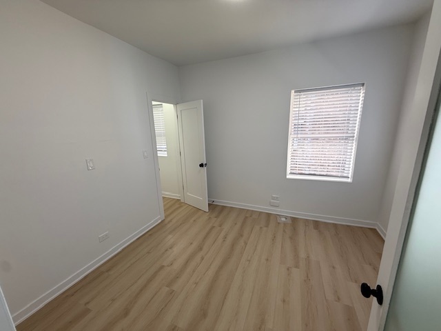 7717 North Sheridan Road, Unit 3R Chicago, IL 60626 - Photo 8 of 17 an empty room with a window