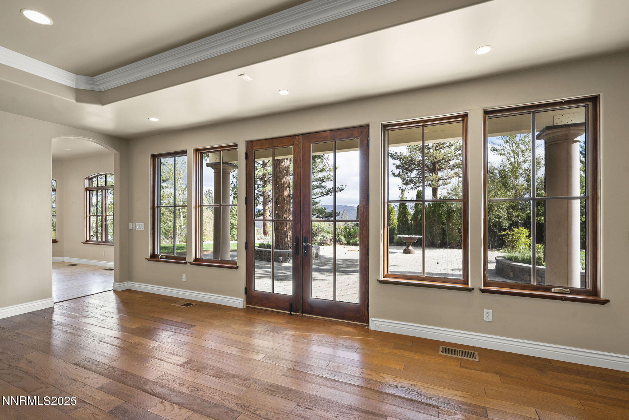 4810 West Pinewild Road Reno, NV 89511 - Photo 24 of 42 a view of an empty room with wooden floor and a window