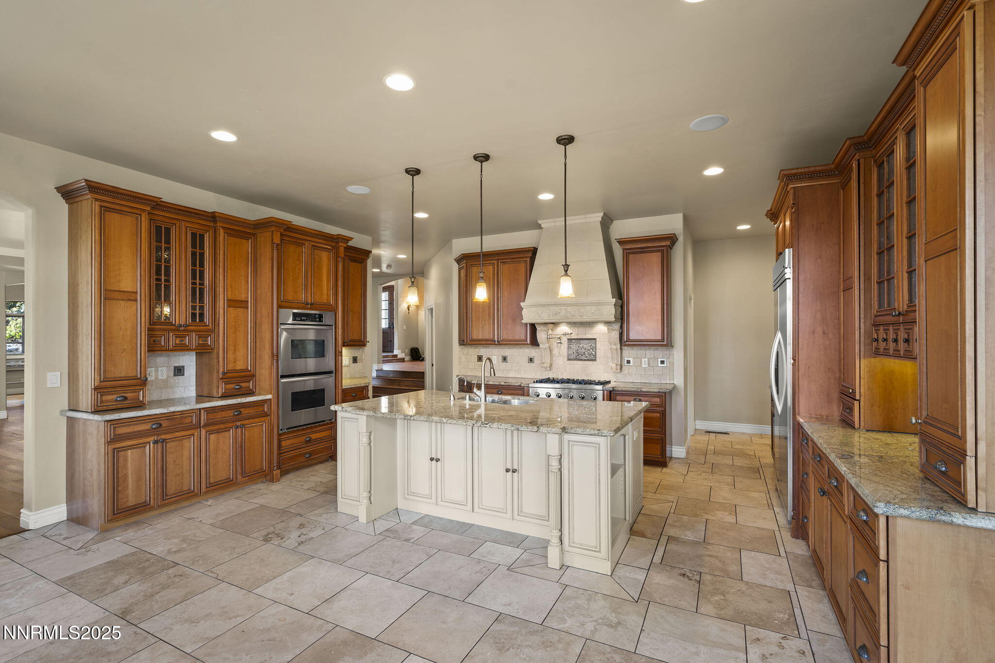 4810 West Pinewild Road Reno, NV 89511 - Photo 25 of 42 a kitchen with stainless steel appliances granite countertop a sink and a refrigerator