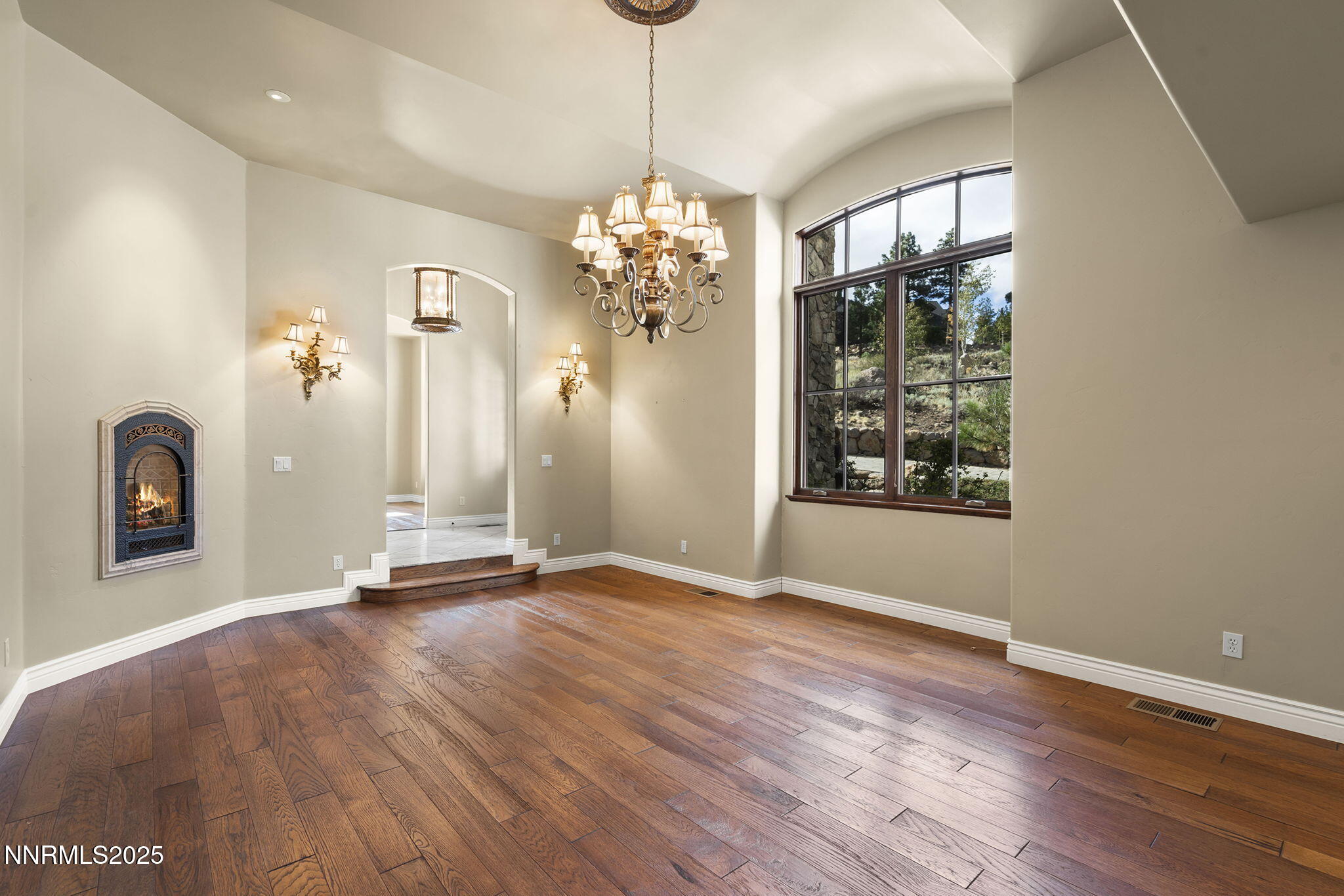 4810 West Pinewild Road Reno, NV 89511 - Photo 29 of 42 a view of a room with wooden floor chandelier and windows