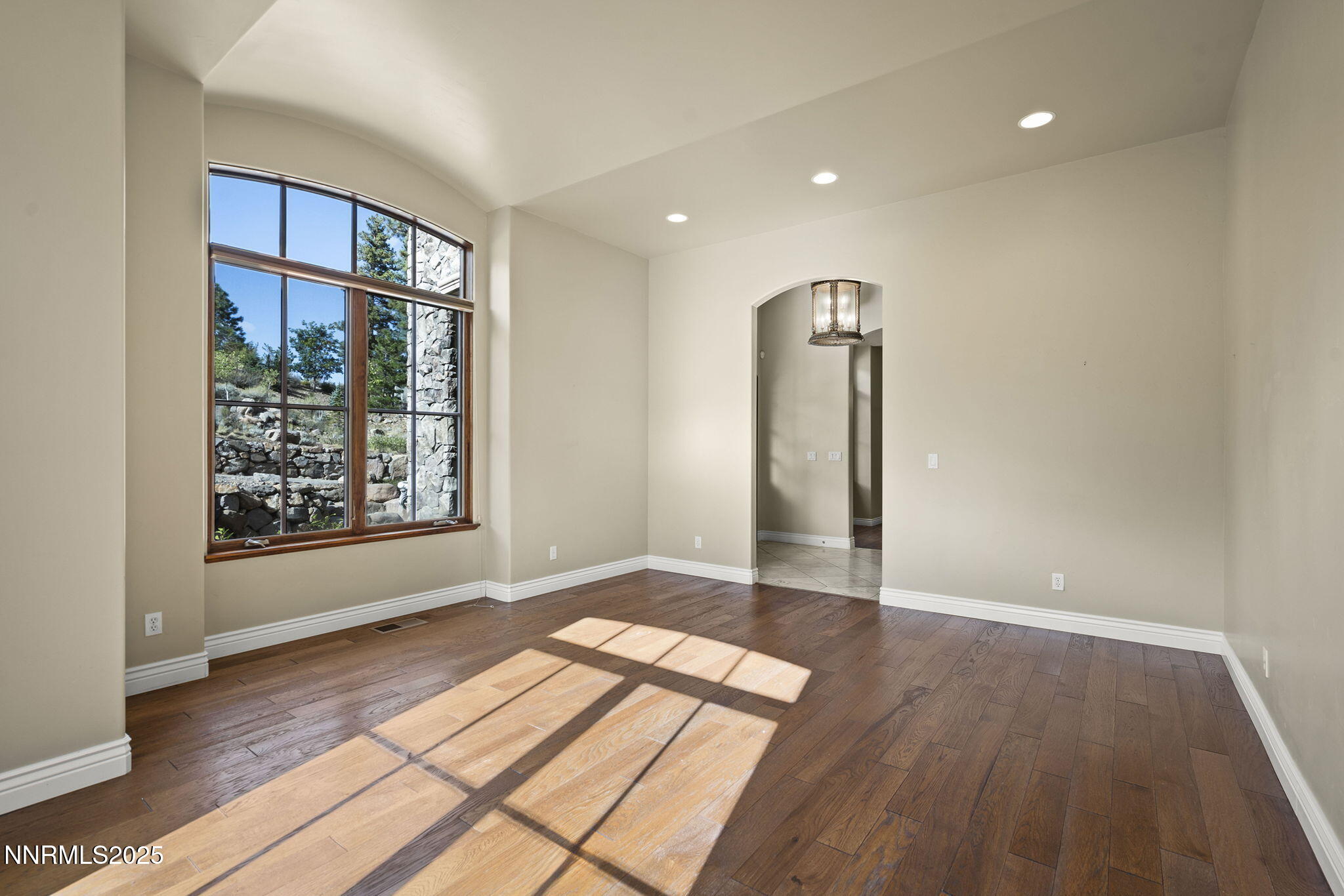 4810 West Pinewild Road Reno, NV 89511 - Photo 31 of 42 wooden floor in an empty room with a window