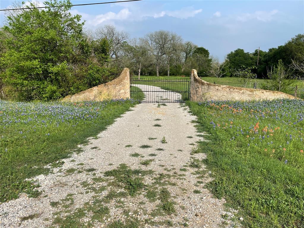 16824 Wortham Bend Road China Spring, TX 76633 - Photo 5 of 16 a view of a road with a yard