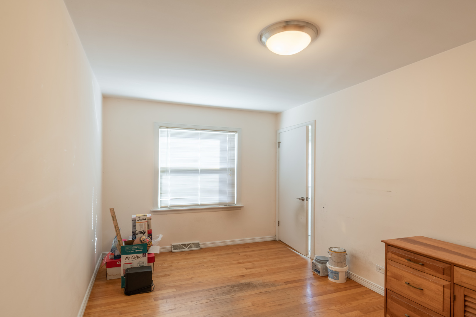 743 Spring Road Elmhurst, IL 60126 - Photo 11 of 21 a view of a room with wooden floor and fan