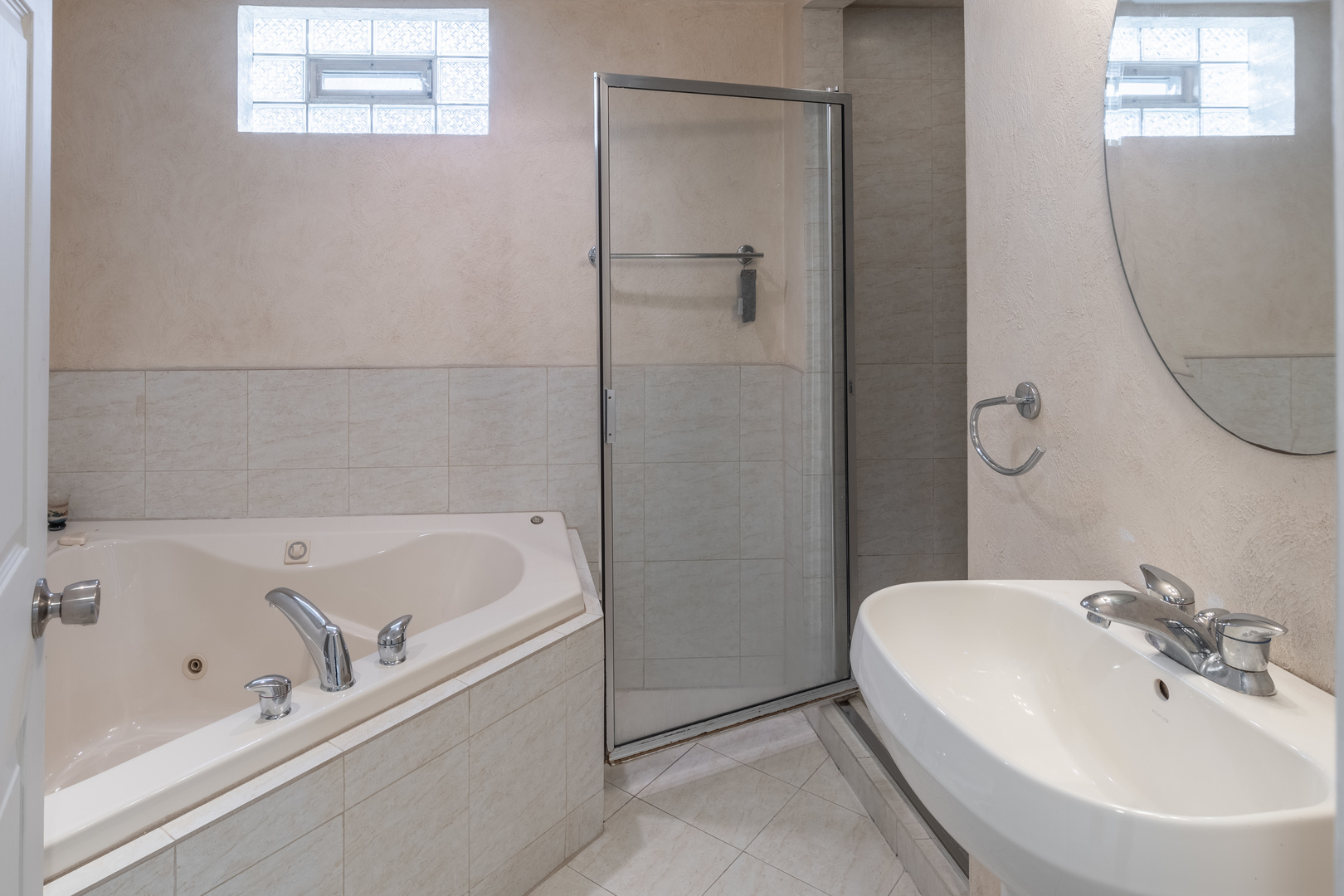 743 Spring Road Elmhurst, IL 60126 - Photo 14 of 21 a white bath tub sitting next to a white sink and a mirror