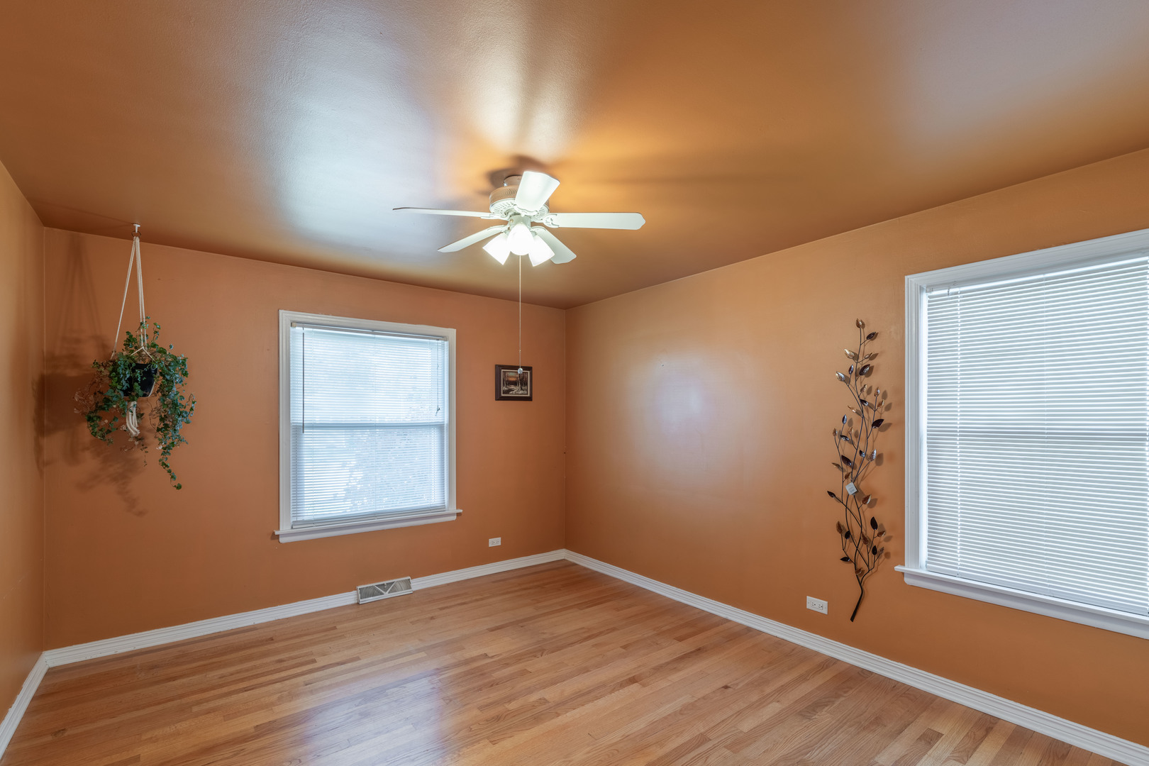 743 Spring Road Elmhurst, IL 60126 - Photo 9 of 21 an empty room with windows and fan