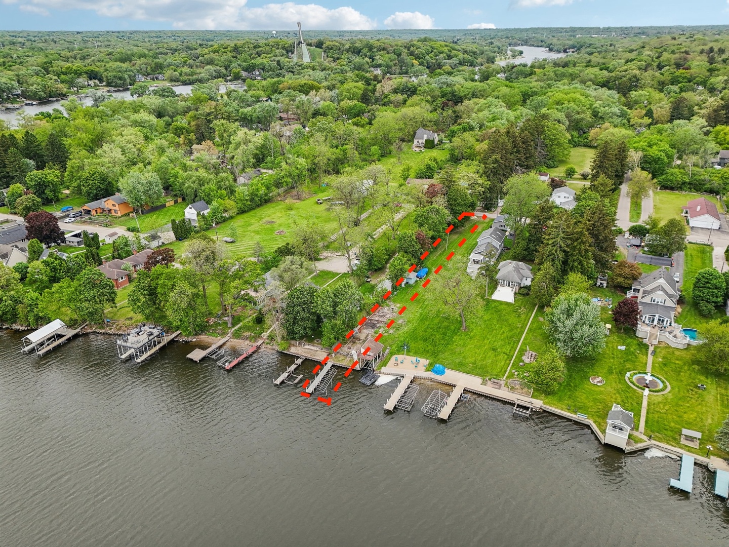 28876 West Pioneer Grove Road Cary, IL 60013 - Photo 2 of 13 a view of a street with a wooden fence