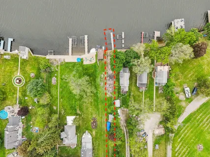 a vase of flowers sitting next to a road