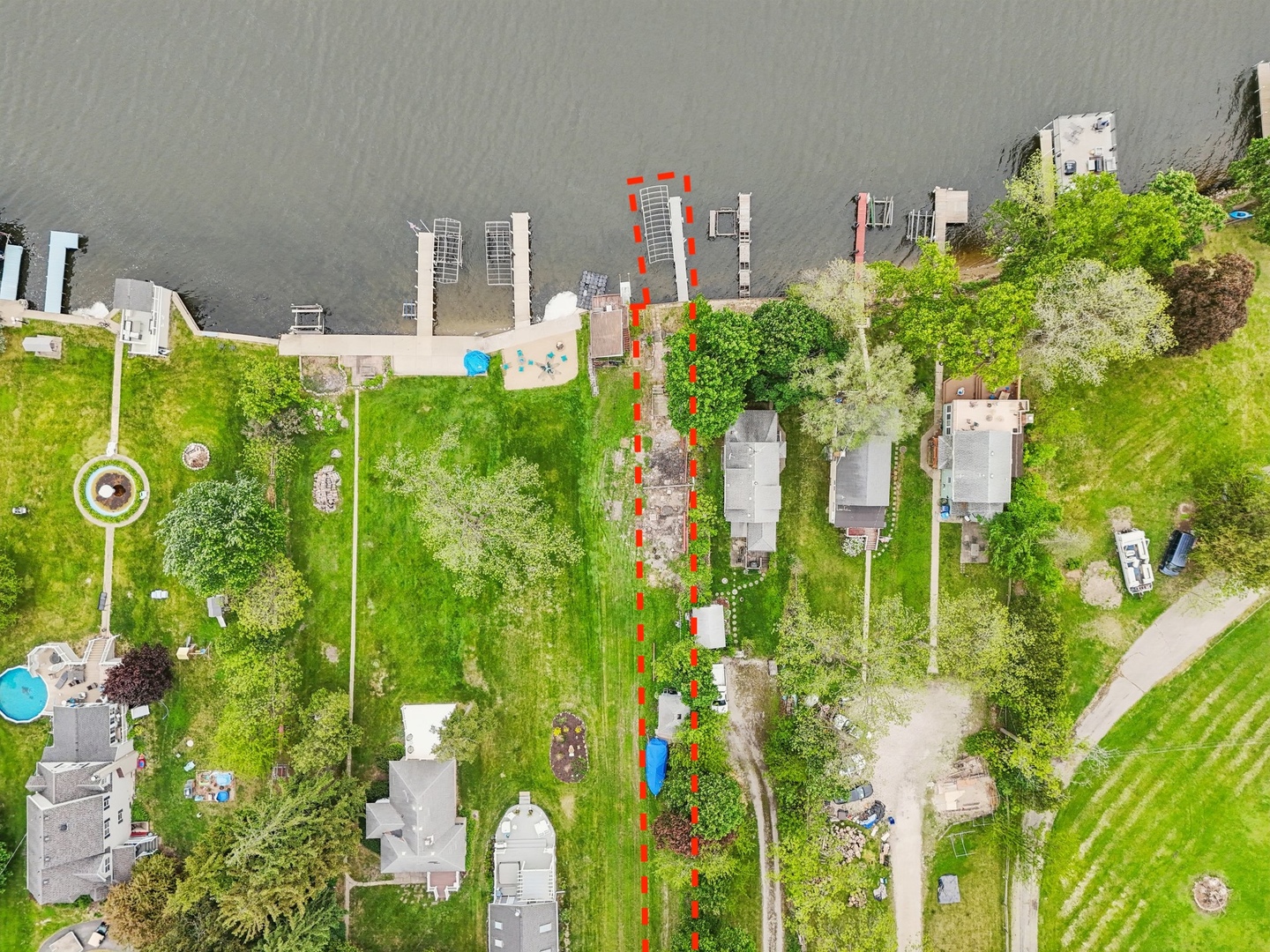 28876 West Pioneer Grove Road Cary, IL 60013 - Photo 3 of 13 a vase of flowers sitting next to a road