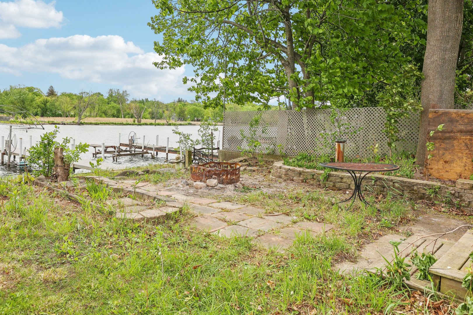 28876 West Pioneer Grove Road Cary, IL 60013 - Photo 8 of 13 a garden with wooden fence