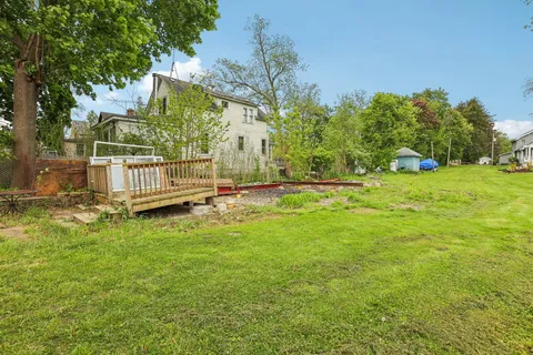 a view of backyard with green space
