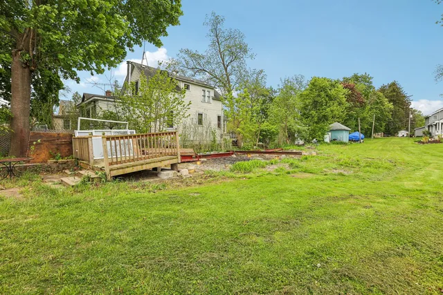 a view of backyard with green space